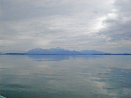 The Alps over Chiemsee in a cloudy summer day